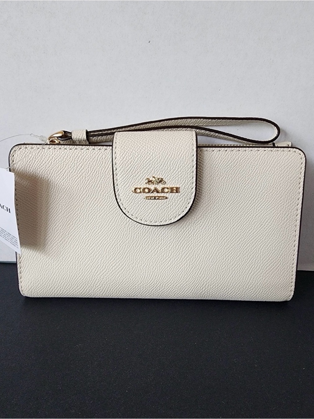 COACH Pebbled Leather tech wristlet in color Chalk *nwt
